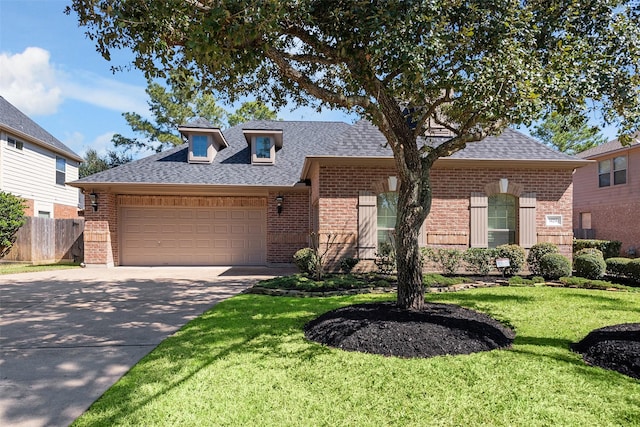 view of front of property featuring a garage, concrete driveway, brick siding, and a shingled roof