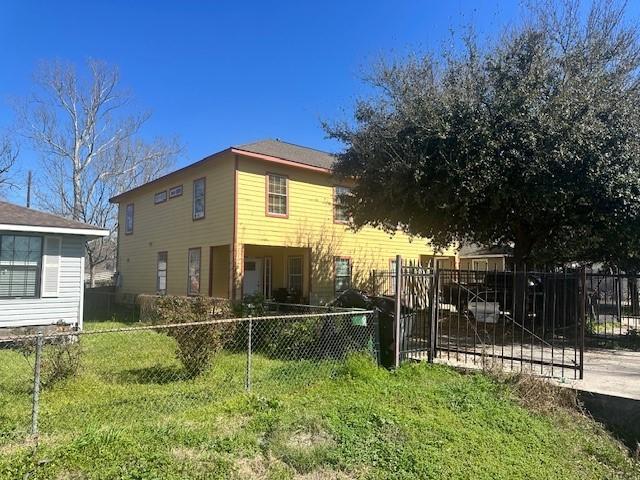 view of home's exterior featuring a yard and a fenced front yard