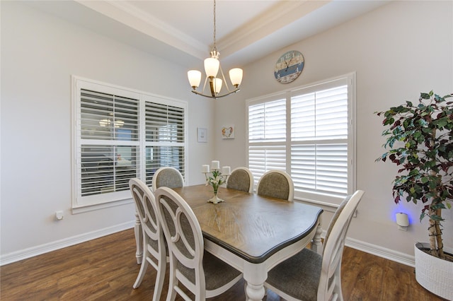 dining room with a chandelier, dark wood-style flooring, and baseboards