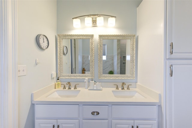 bathroom featuring a sink and double vanity