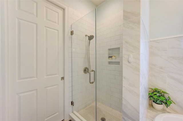 bathroom with a stall shower