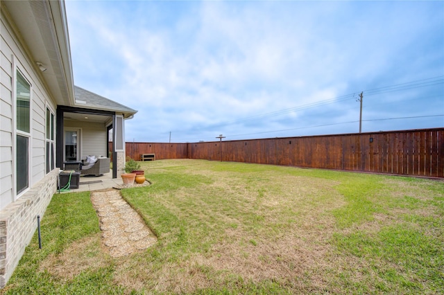 view of yard with a fenced backyard