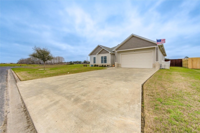 ranch-style home featuring brick siding, concrete driveway, an attached garage, a front yard, and fence