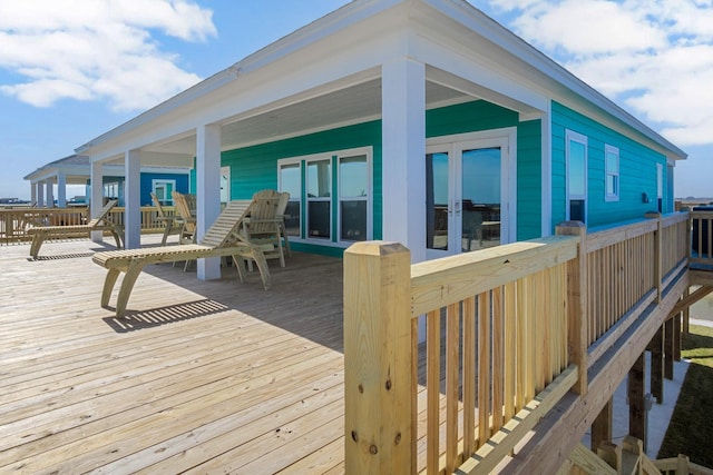 wooden deck featuring french doors