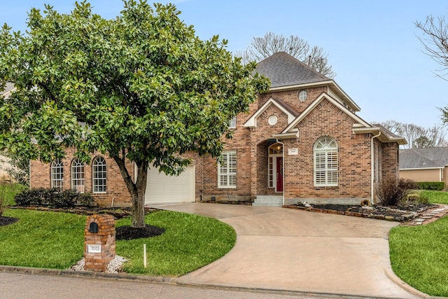 view of front of home with brick siding, a shingled roof, concrete driveway, a garage, and a front lawn