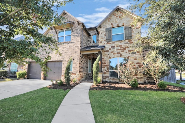 traditional-style home with brick siding, a garage, stone siding, driveway, and a front lawn