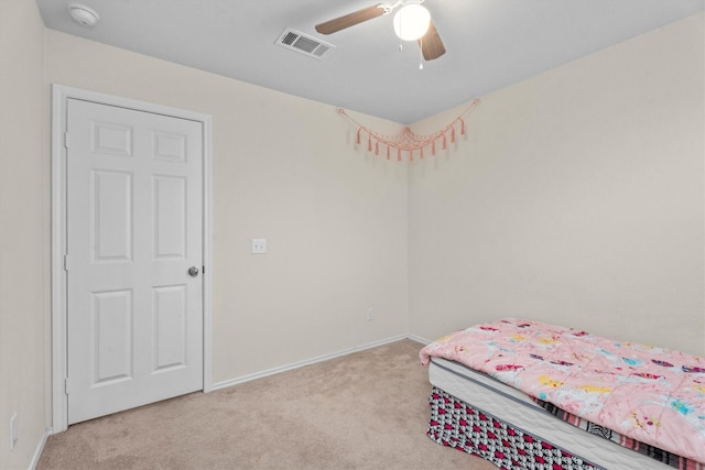 bedroom with light carpet, baseboards, visible vents, and ceiling fan