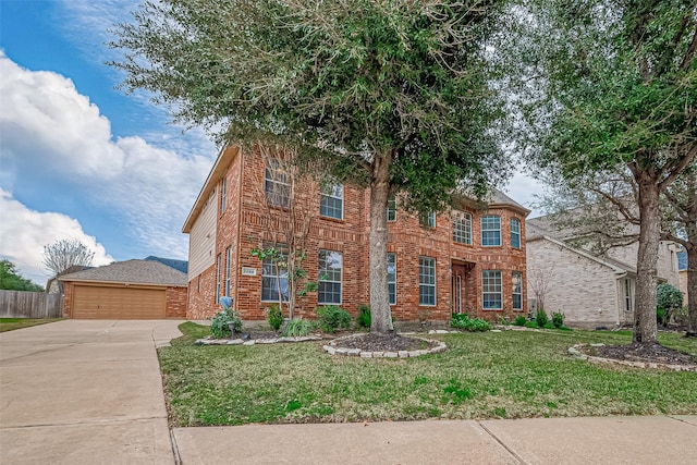 view of front of home featuring a garage, a front yard, brick siding, and fence