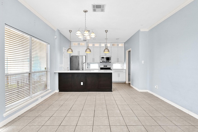 kitchen with visible vents, white cabinets, glass insert cabinets, stainless steel appliances, and light countertops