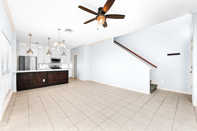 kitchen with visible vents, a ceiling fan, stainless steel appliances, light countertops, and a sink