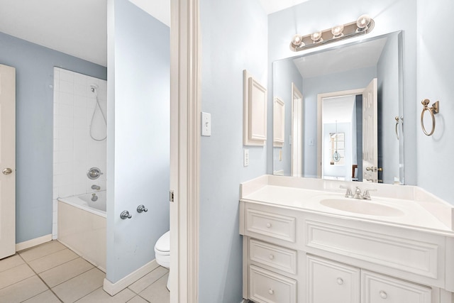 bathroom featuring toilet, vanity,  shower combination, tile patterned flooring, and baseboards