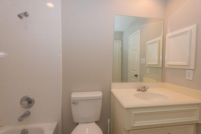 bathroom with toilet, bathtub / shower combination, and vanity