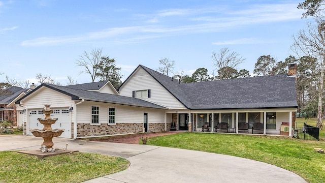 view of front facade with concrete driveway, covered porch, an attached garage, a front yard, and fence