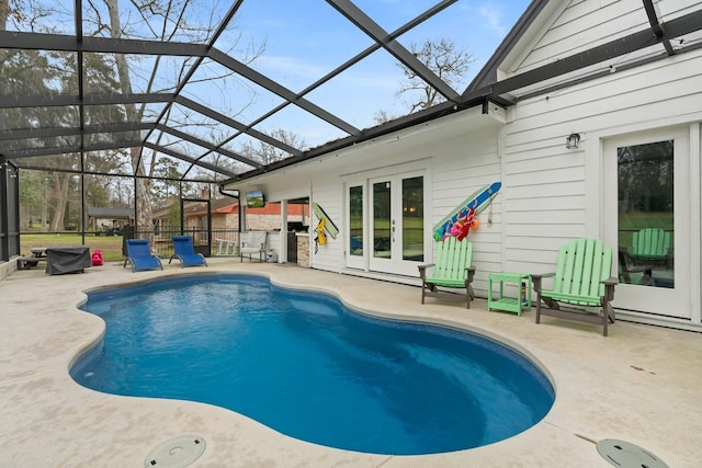 view of pool with a fenced in pool, french doors, a patio area, fence, and a lanai