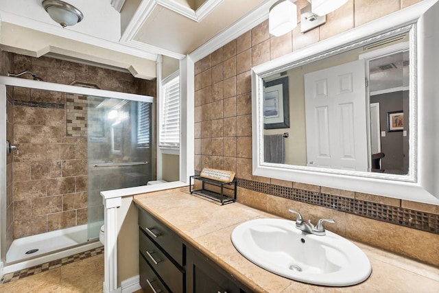 full bath with crown molding, backsplash, toilet, a shower stall, and vanity