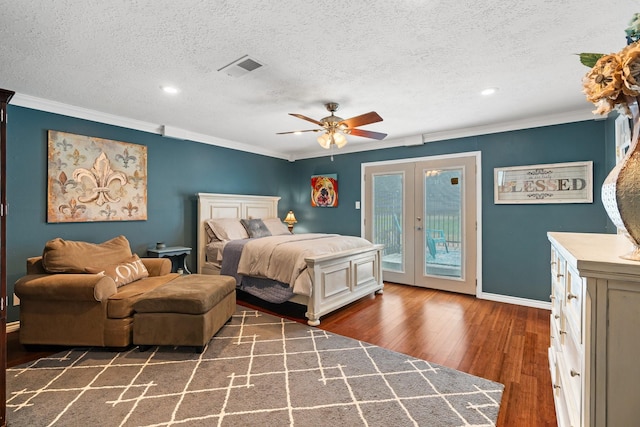 bedroom with access to exterior, french doors, dark wood-type flooring, and crown molding