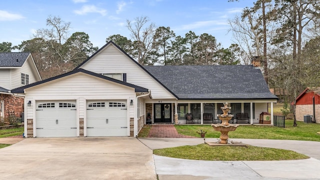 view of front of house with a shingled roof, concrete driveway, an attached garage, and central AC unit