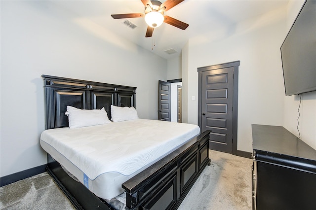 bedroom featuring light carpet, ceiling fan, visible vents, and baseboards