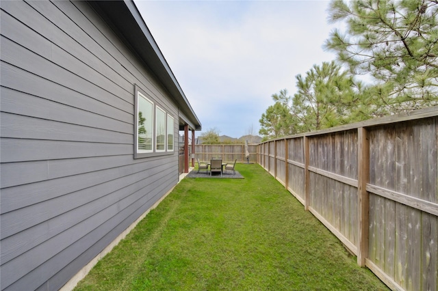 view of yard with a fenced backyard