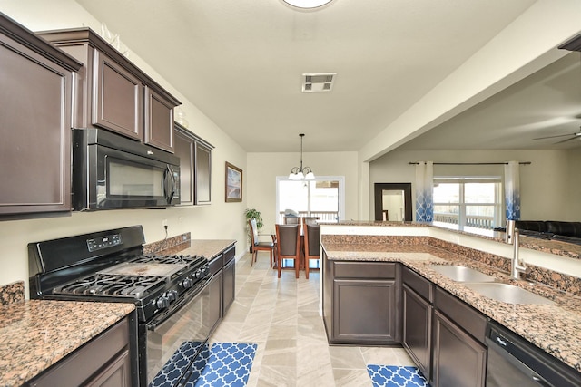 kitchen with black appliances, visible vents, a wealth of natural light, and a sink