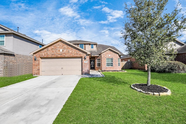 traditional-style house featuring brick siding, concrete driveway, an attached garage, fence, and a front yard