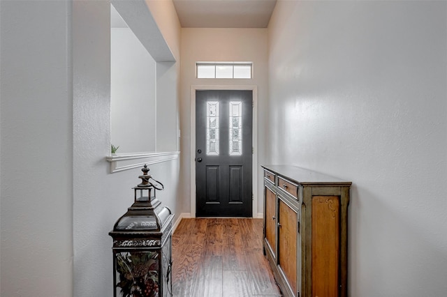 foyer entrance featuring dark wood finished floors