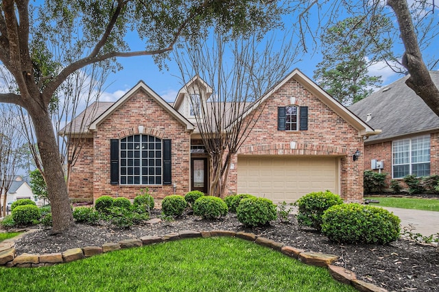 traditional-style house with driveway and brick siding