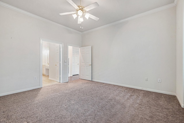 unfurnished bedroom with light carpet, baseboards, and crown molding