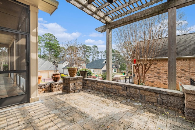 view of patio with a residential view and a pergola