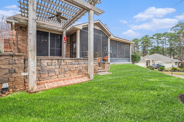 view of property exterior featuring a yard, a sunroom, fence, a pergola, and stone siding