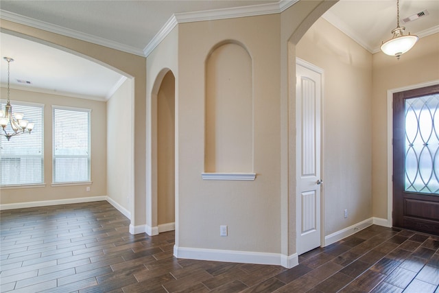 entrance foyer featuring ornamental molding, wood tiled floor, visible vents, and baseboards