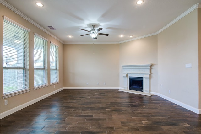 unfurnished living room with visible vents, ornamental molding, a fireplace with raised hearth, and dark wood-style flooring