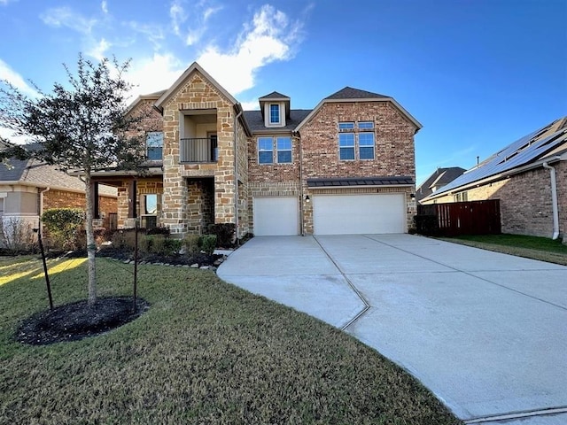 traditional-style home with fence, driveway, an attached garage, a front lawn, and stone siding