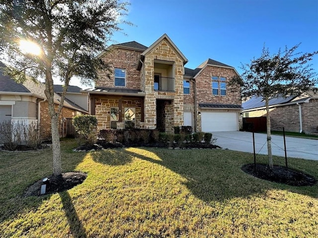 traditional home featuring a front lawn, concrete driveway, stone siding, and an attached garage