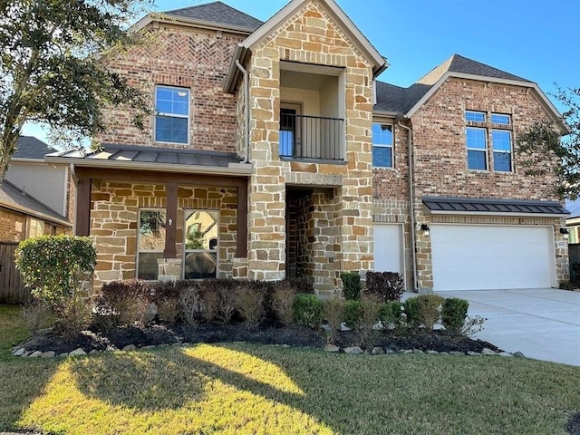view of front facade with a front yard, a garage, stone siding, driveway, and a standing seam roof