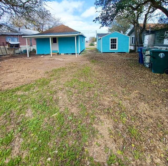 view of yard with an outbuilding and a shed