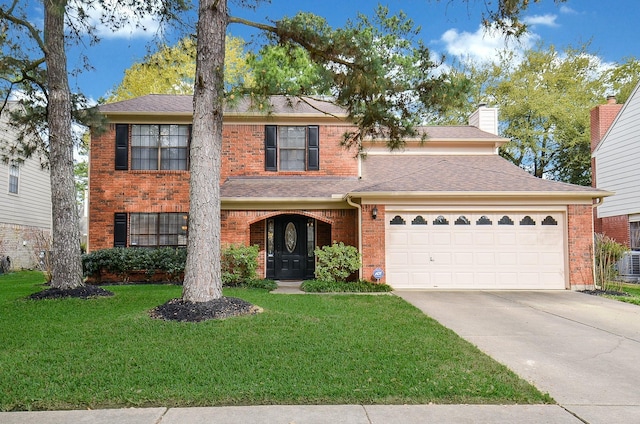 view of front of property featuring a garage, driveway, brick siding, a chimney, and a front yard