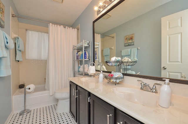 bathroom with a sink, shower / bathtub combination with curtain, toilet, and tile patterned floors