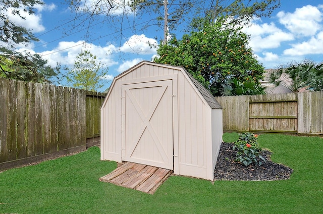 view of shed with a fenced backyard