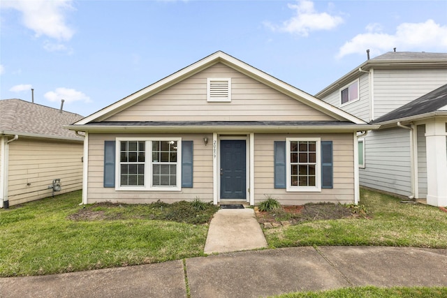 view of front of home featuring a front lawn