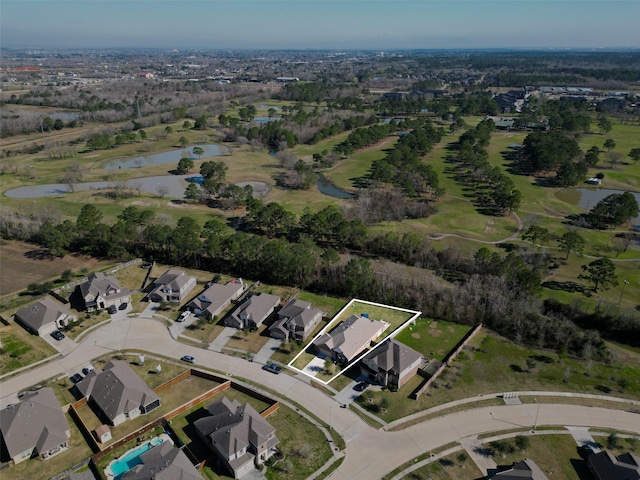 birds eye view of property with a water view and a residential view