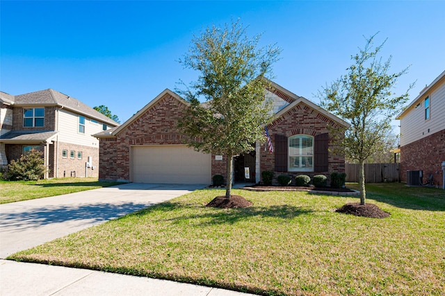 view of front facade with a front yard, concrete driveway, brick siding, and cooling unit