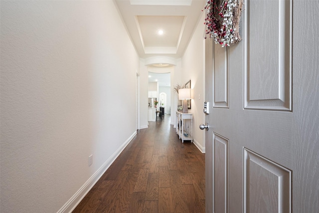 hall with dark wood-style floors and baseboards