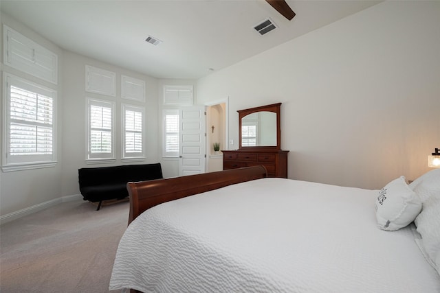 bedroom with carpet floors, multiple windows, and visible vents