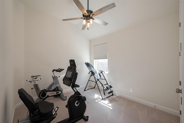 exercise room with light colored carpet, vaulted ceiling, baseboards, and ceiling fan