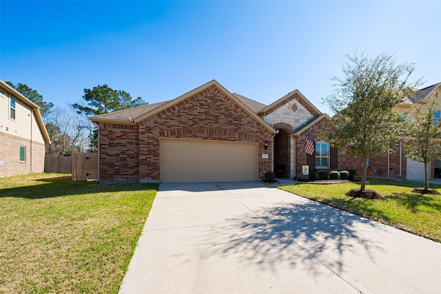 view of front facade featuring a garage, brick siding, fence, driveway, and a front yard