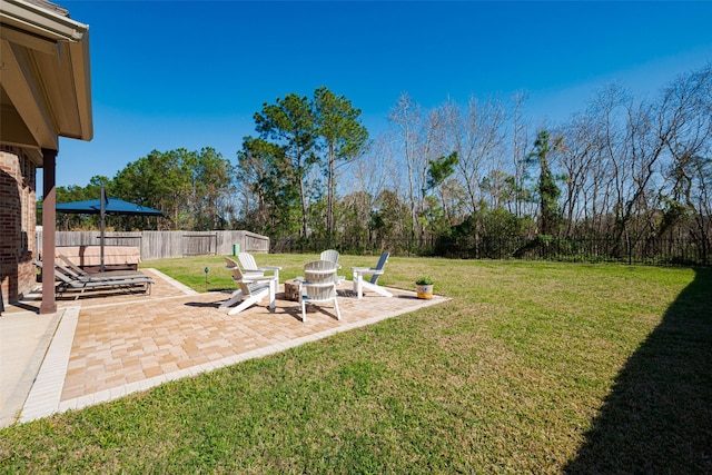 view of yard with a patio area and a fenced backyard