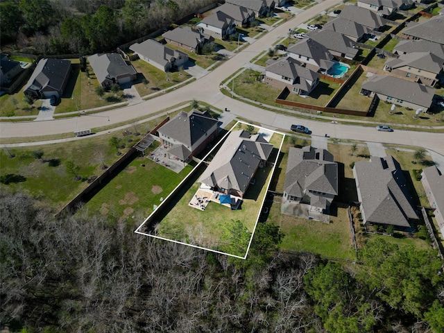 birds eye view of property with a residential view