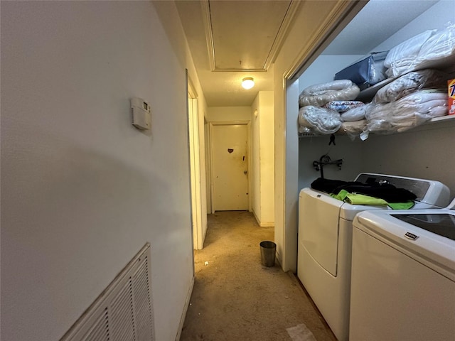 laundry room featuring visible vents, laundry area, attic access, and washer and dryer