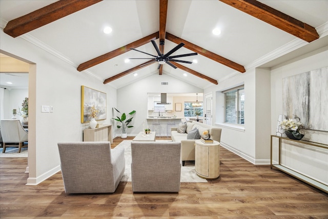 living area with baseboards, vaulted ceiling with beams, light wood-type flooring, a chandelier, and recessed lighting